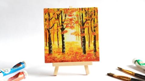 Small canvas of a fall scene of trees and leaves