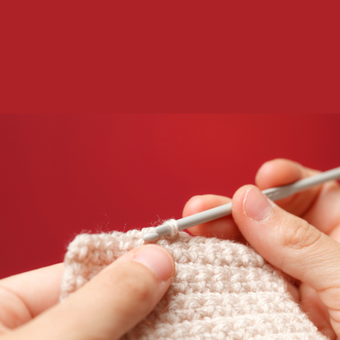 Person crocheting 