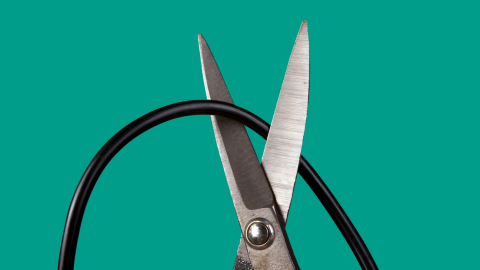 scissors cutting tv cable
