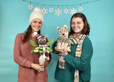 adults holding puppets